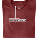 A close up of the tagless itch-free dark orange tall t-shirt neck label.