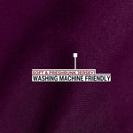 A close up of the dark purple 100% organic cotton fabric.