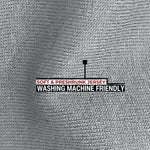 A close up of the light grey 100% organic cotton fabric.