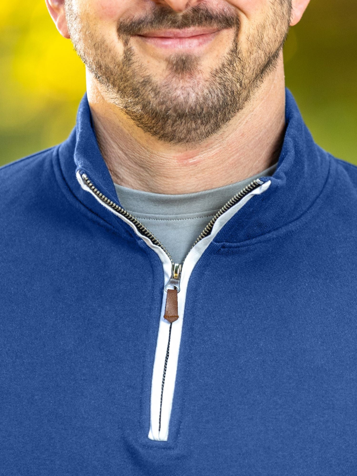 A close-up of the quarter zip collar and the A close-up of the quarter zip collar and the durable metal zipper. metal zipper.