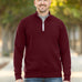 A tall and slim man standing on a path in  a park. The smiling model is wearing a maroon quarter zip sweatshirt. The tall maroon quarter zip sweatshirt features 2.5" longer sleeves, 100% organic french terry cotton, and is soft & comfy. It's  ideal for tall slim men 6'2"+.