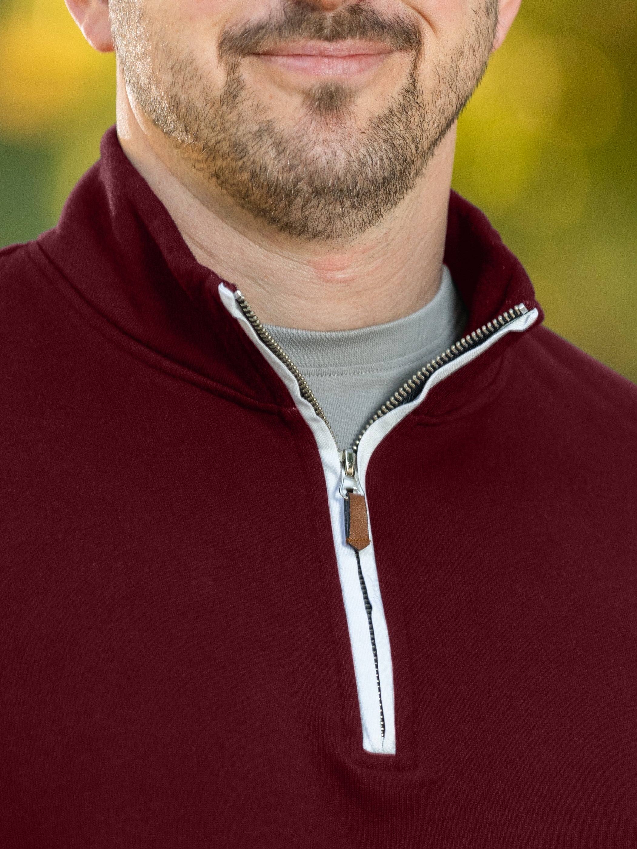 A close-up of the quarter zip collar and the A close-up of the quarter zip collar and the durable metal zipper. metal zipper.