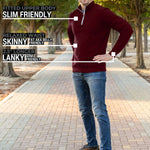 A head to toe shot of a tall slim guy in a park wearing an XL tall extra long maroon quarter zip sweatshirt.