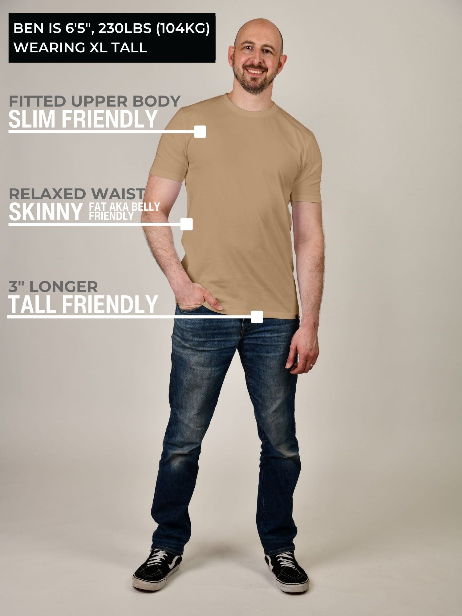 A head to toe shot of a tall athletic guy wearing a tan XL tall t-shirt.