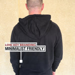 A shot from behind of a tall slim guy wearing an XL tall slim black hoodie.