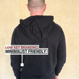 A shot from behind of a tall slim guy wearing an XL tall slim black hoodie.