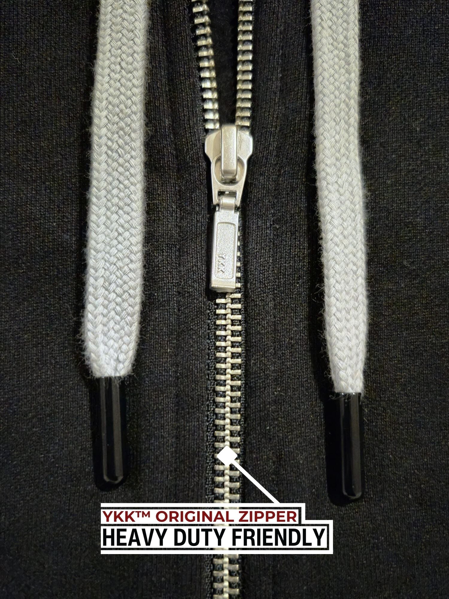 A close up of a black tall slim hoodie with a YKK zipper.