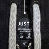 A close up of a black tall slim hoodie with light grey drawstrings.