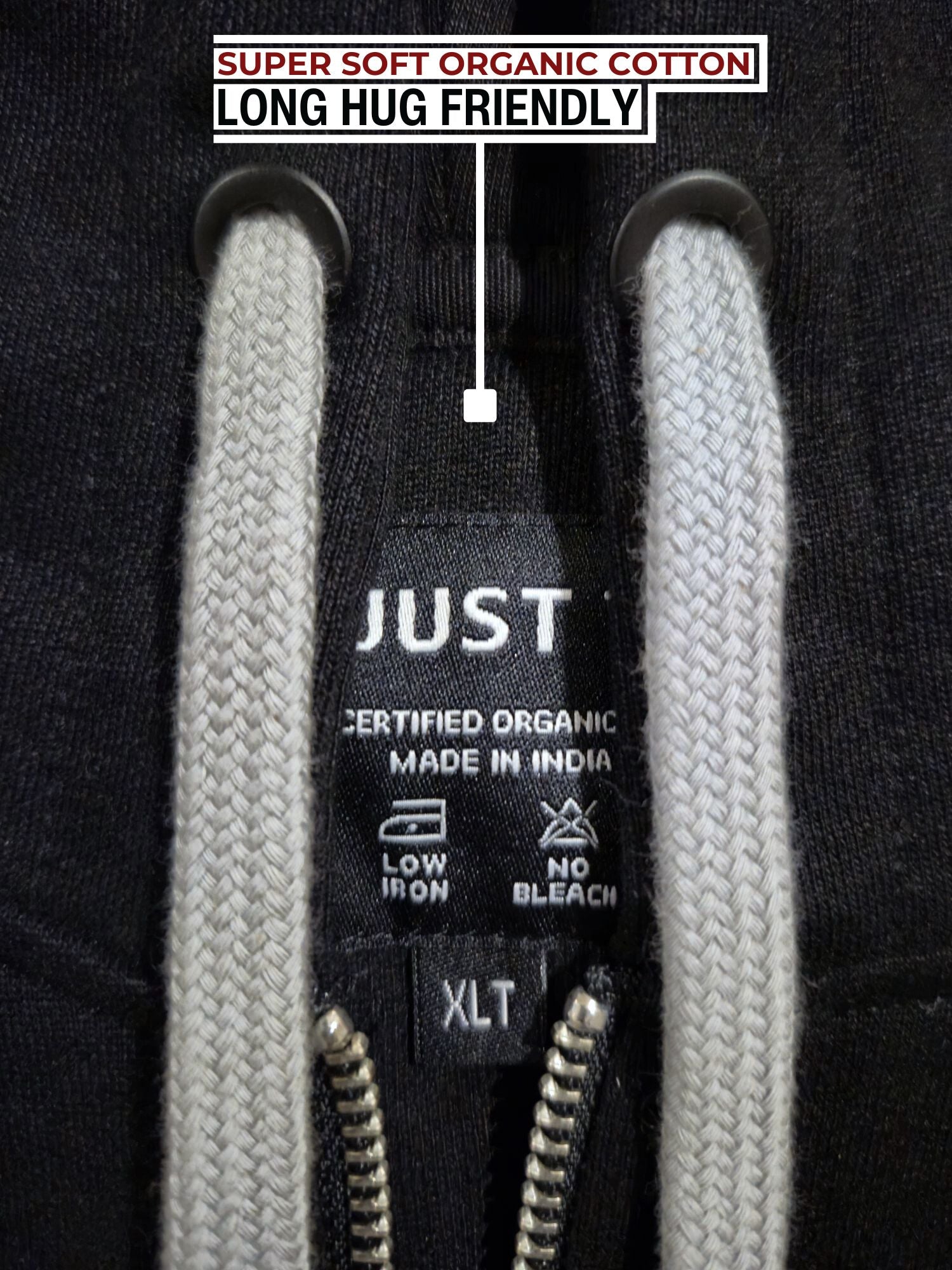 A close up of a black tall slim hoodie with light grey drawstrings.