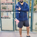 A head to toe shot of a tall and broad guy standing in a tennis court and wearing a 2XL Tall dark navy zip-up hoodie.