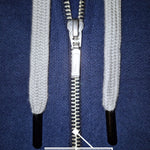 A close up of a dark navy tall slim hoodie with a YKK zipper.