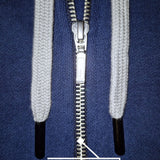 A close up of a dark navy tall slim hoodie with a YKK zipper.