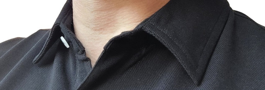Close up of a tall pique polo collar, reinforced with interlining and stay flat.