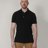 A tall slim guy wearing a black XL tall polo shirt.