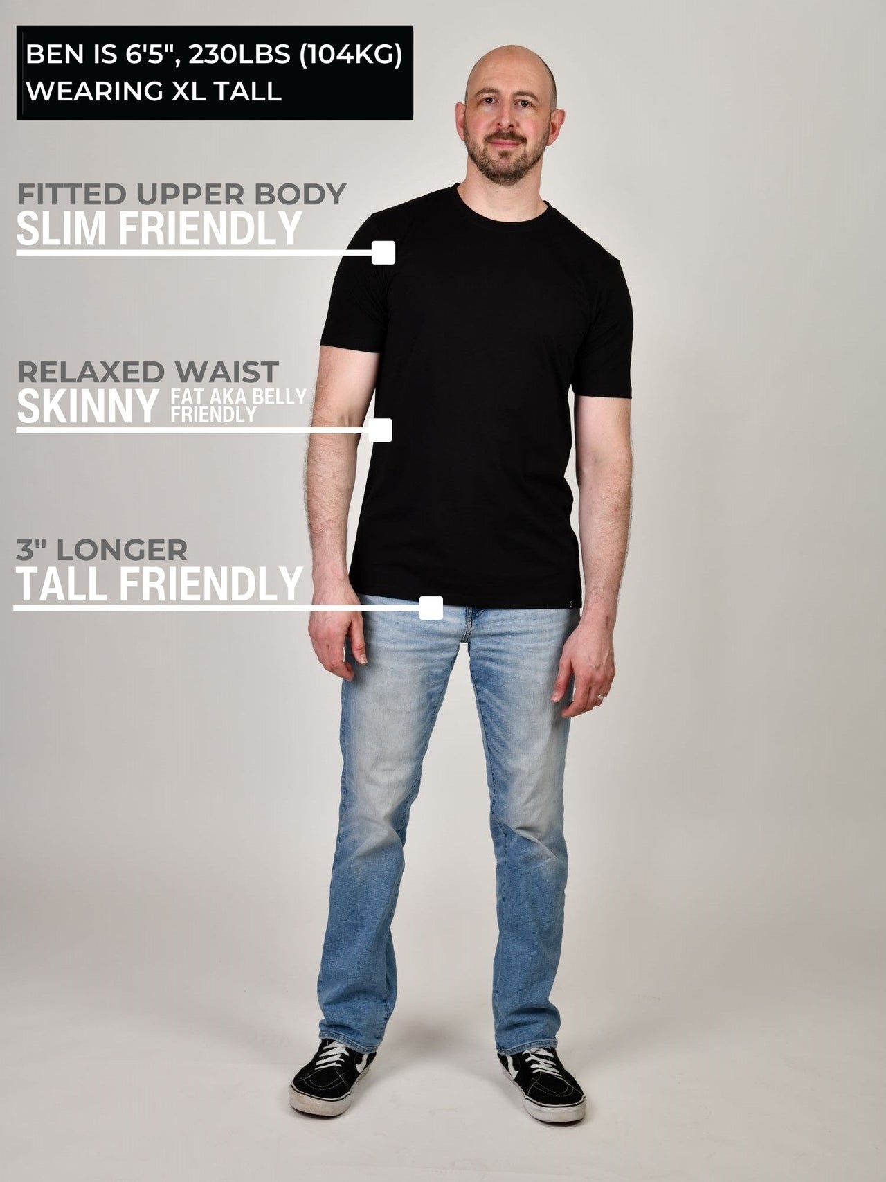 A head to toe shot of a tall muscular guy wearing a black XL tall t-shirt.