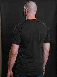 Thumbnail for A shot from behind of a tall and slim guy in the studio and wearing a charcoal XL tall slim t-shirt.