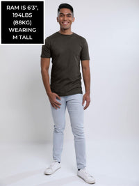 Thumbnail for A head to toe shot of a tall and slim guy in the studio wearing a grey medium tall slim t-shirt.