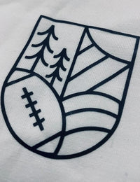 Thumbnail for A close up shot of the graphic on the upper left chest of the t-shirt: a volleyball, a tree, hills and the Sun shaped into a crest.