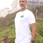 An upper body shot of a tall slim guy in an L tall graphic t-shirt with a landscape design.