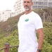 An upper body shot of a tall slim guy in an L tall graphic t-shirt with a landscape design.