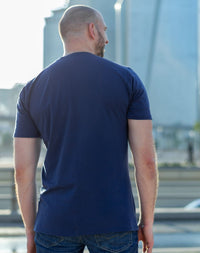 Thumbnail for A shot from behind of a tall slim guy in the street and wearing a navy blue tall slim fit t-shirt.