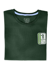 Thumbnail for A close up of a tall green graphic t-shirt.