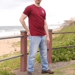 A head to toe shot of a tall slim guy wearing an XL tall graphic t-shirt with a tree design.