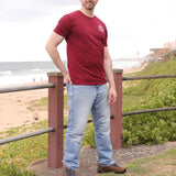 A head to toe shot of a tall slim guy wearing an XL tall graphic t-shirt with a tree design.