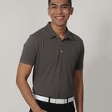 A tall skinny guy smiling and wearing a grey medium tall polo shirt.