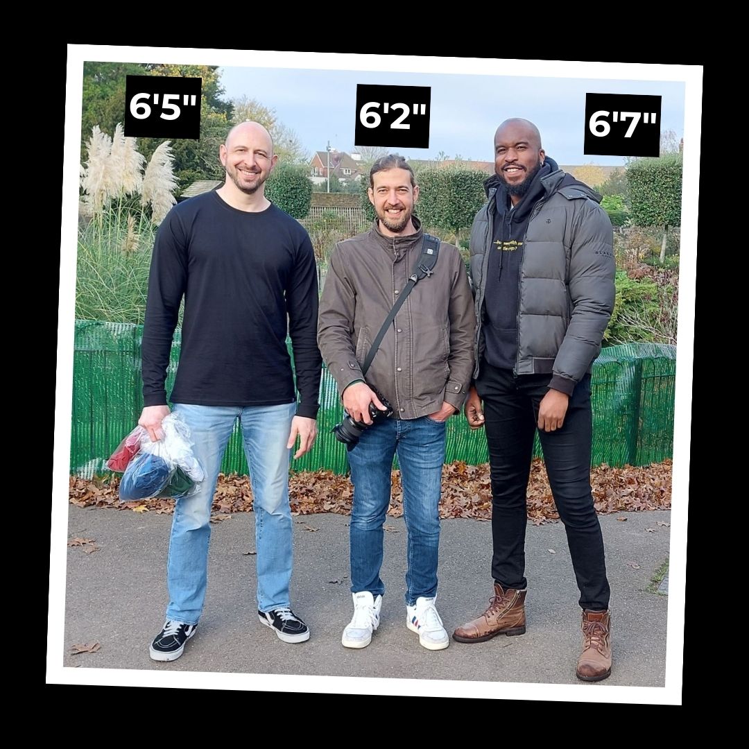 6'5" Ben, 6'2" Antonio and 6'7" Roy standing in a park after their tall long sleeve photoshoot.