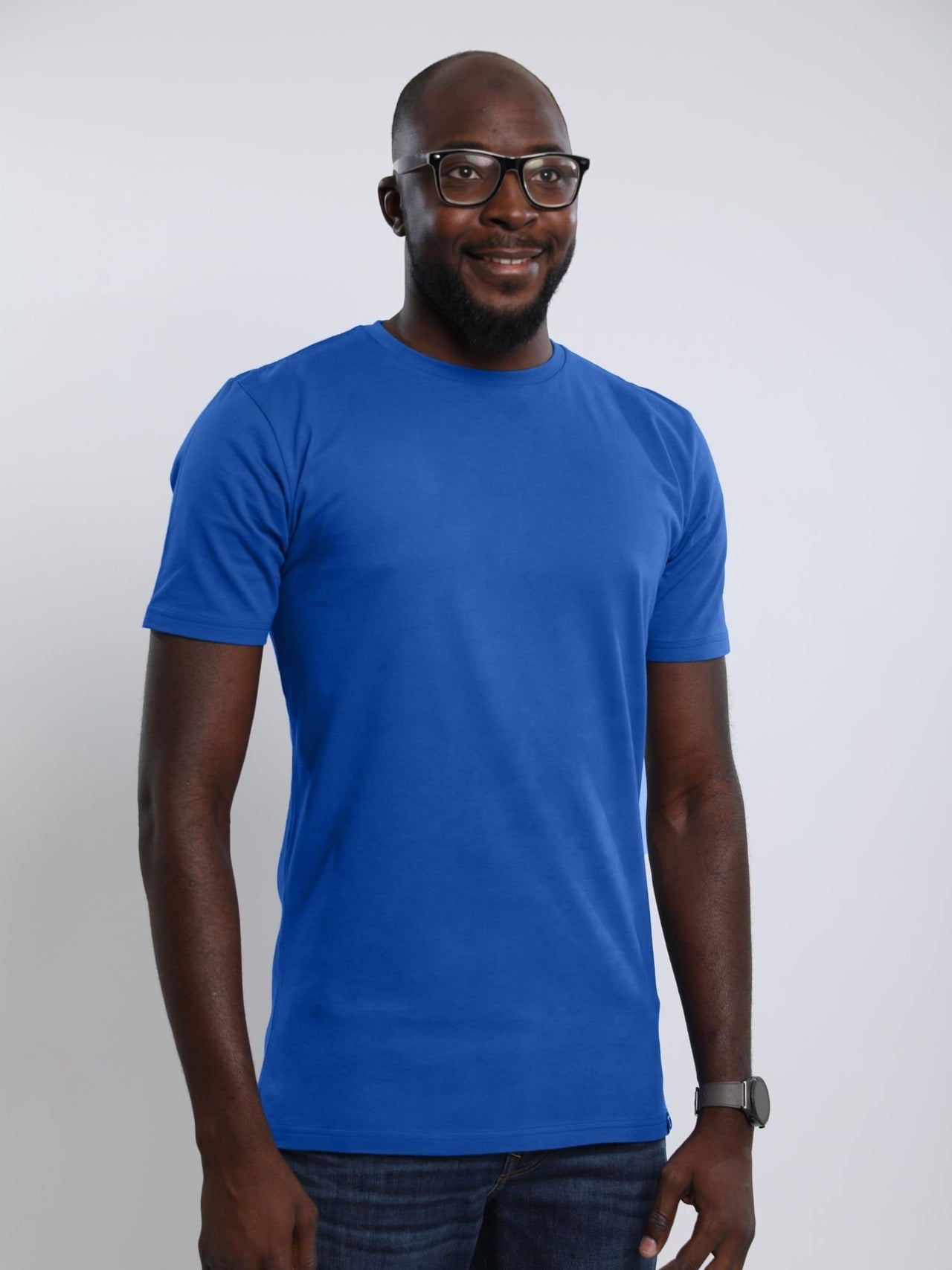 Tall skinny guy wearing a medium blue tall t-shirt.