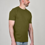 A tall athletic guy wearing a military green XL tall t-shirt and looking to the right.