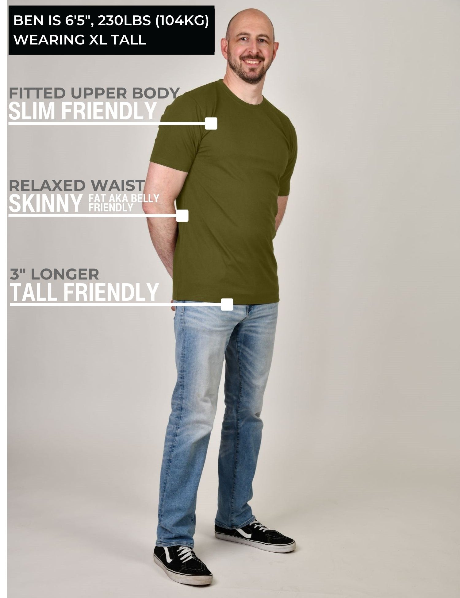 A head to toe shot of a tall athletic guy wearing a military green XL tall t-shirt.