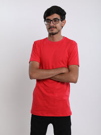 Thumbnail for A tall skinny guy in the studio with his arms folded and wearing a red small tall slim t-shirt.
