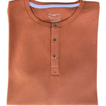 A close up of a tall brown short sleeve henley shirt.