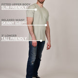 A head to toe shot of a tall and slim guy in the studio wearing an XL tall sage green slim v-neck t-shirt.