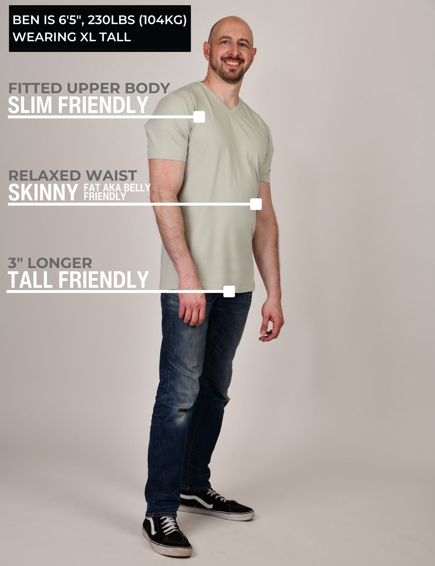 A head to toe shot of a tall and slim guy in the studio wearing an XL tall sage green slim v-neck t-shirt.