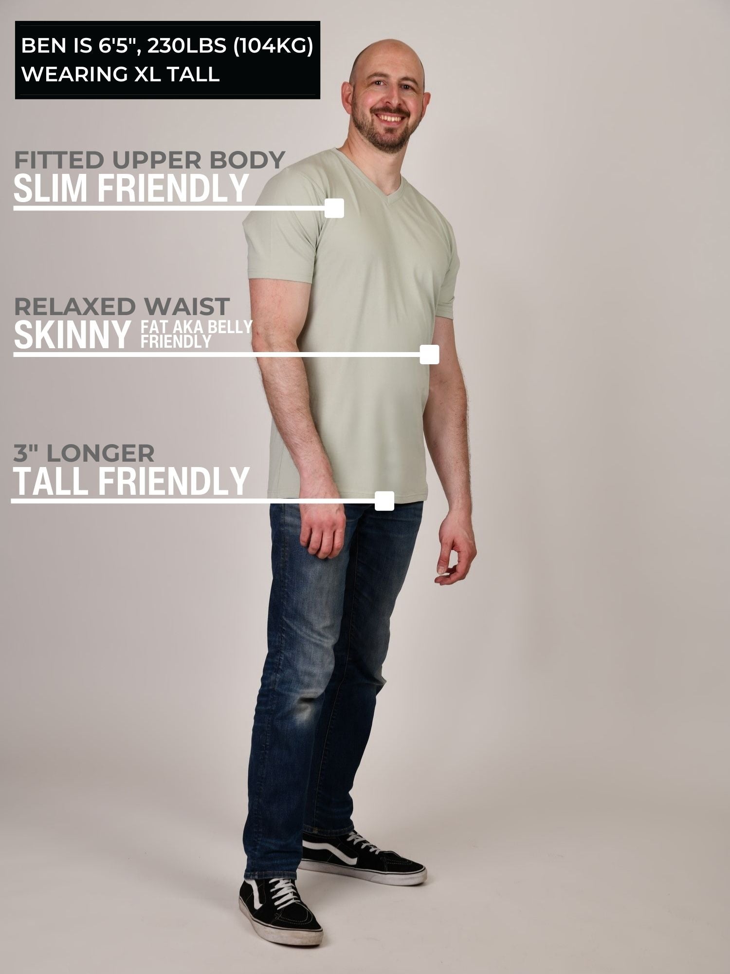 A head to toe shot of a tall and slim guy in the studio wearing an XL tall sage green slim v-neck t-shirt.