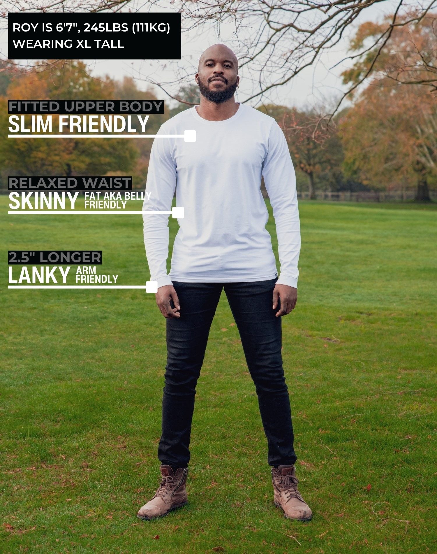 A head to toe shot of a tall athletic guy in a park wearing a white long sleeve tall t-shirt.