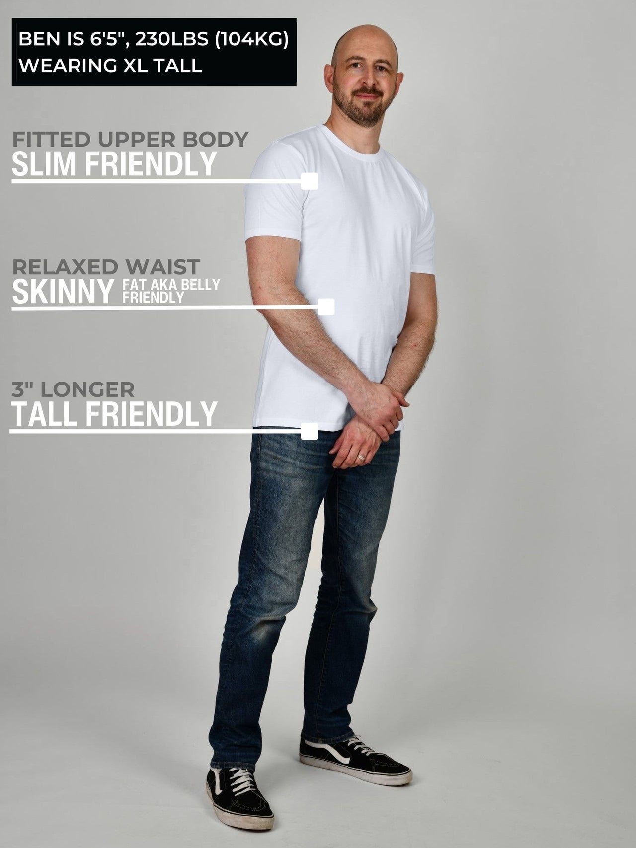 A head to toe shot of a tall muscular guy wearing a white XL tall t-shirt.